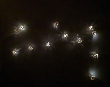 Many small decorative luminous balls, night time
