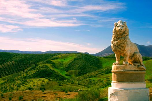 Statue of lion in the background of fields, Spain