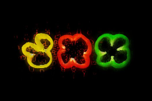 Three slices of green red and yellow pepper with glitch effect on the black background