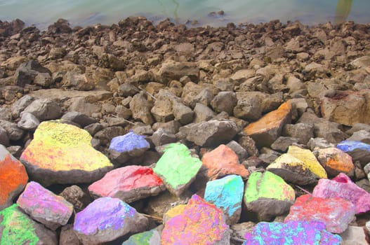 Multicolored stones in the yacht bay, summer, Portugal