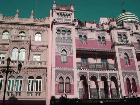 Historical pink building in arabic style in Seville, Spain