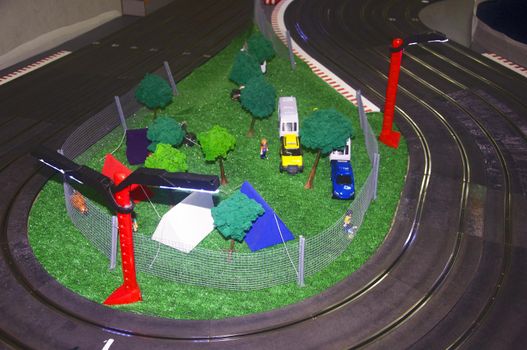 Small toy camp with tracks and red lanterns, left up view