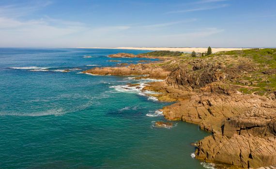 Aerial view of the Stockton Sand Dunes and blue water of the Tasman Sea at Birubi Point near Port Stephens in regional New South Wales in Australia