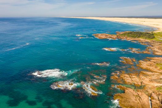 Aerial view of the Stockton Sand Dunes and blue water of the Tasman Sea at Birubi Point near Port Stephens in regional New South Wales in Australia