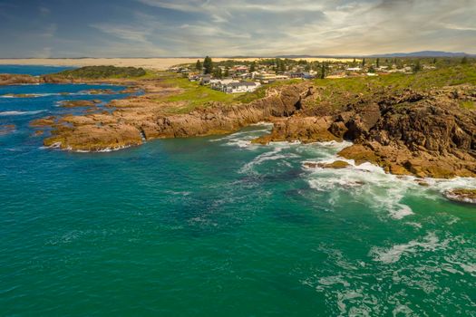 Aerial view of the Stockton Sand Dunes and blue water of the Tasman Sea at Birubi Point near Port Stephens in regional New South Wales in Australia