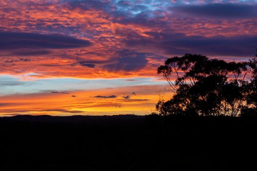 Vibrant red sunset caused by bushfire smoke in the blue mountains in australia