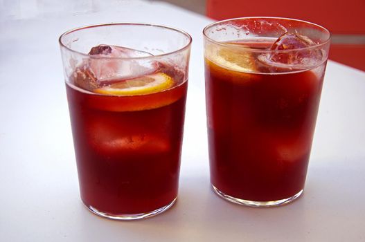 Two glasses with vine cocktail tinto de verano, lemon and ice, summer, Spain