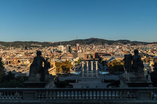High angle view of the area surrounding Plaza de Espana (Spain Square) in Barcelona, with two Venetian towers, the four symbolic Columns and the Avenue leading to the MNAC or Palau Nacional, place from which this photo was taken. Horizontal composition with areas of high contrast.