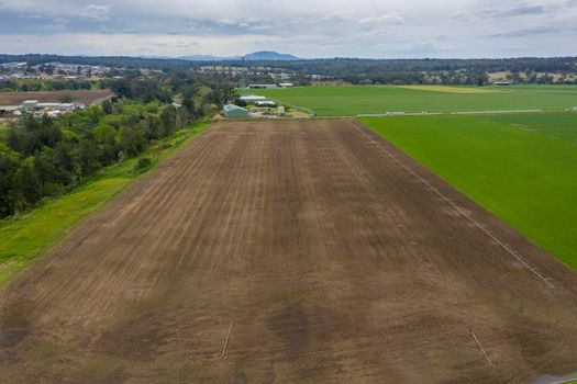 Aerial view of green farmland in the Hunter Valley in regional New South Wales in Australia