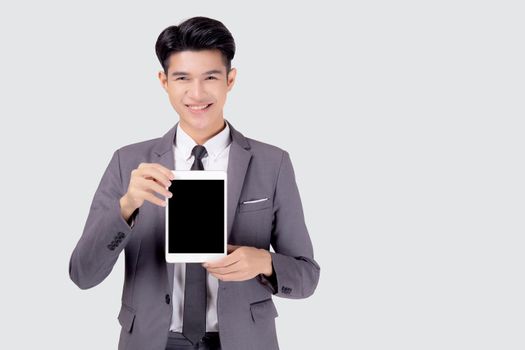 Portrait young asian business man showing and presenting tablet computer with blank with success isolated on white background, businessman standing and holding touchpad digital, communication concept.