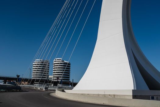 Street level view of Ennio Flaiano Bridge, a cable-stayed bridge with a single pylon located in the center of the traffic circle on the north side of the Pescara river