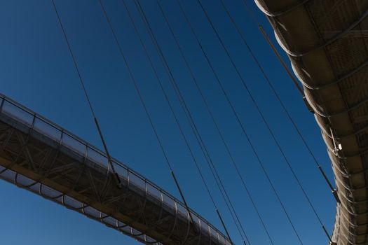 Architectural details of the Ponte del Mare (Bridge of the Sea) in Pescara, Italy. A cable-stayed bridge whose structure is made up of two separate ways, a bicycle path and a footpath. This bridge connects the south coast with the north of the river Pescara.