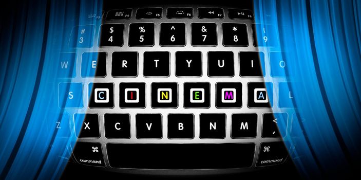 Silver keyboard with word Cinema on it. Blue curtains of online theatre. Watch movies on Internet. Concept of entertainment for people on web. Cyber theater in computer. Design for Internet site.