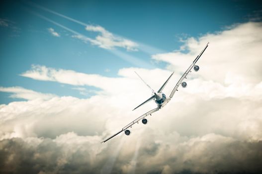 Beautiful view of white plane and blue sky with clouds in background. Aircraft up high in air turning diagonally. Travelling by airplane. Modern design of air transport. Airplane flying over clouds.