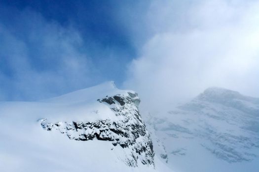 Baikal mountains in winter in snow. Forest in snow-covered mountains.