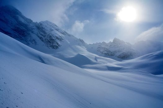 Baikal mountains in winter in snow. Forest in snow-covered mountains.