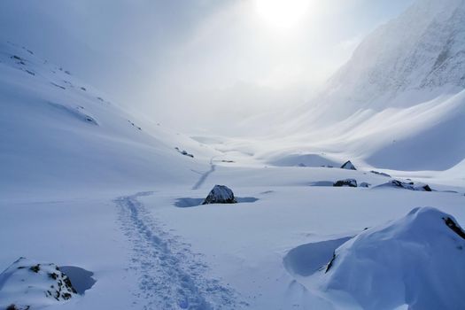 Baikal mountains in winter in snow. Forest in snow-covered mountains.