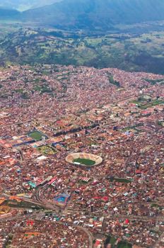 Aerial view of Cusco, Peru. The football stadium is visible in the center of the frame.