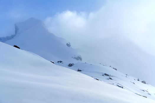 Baikal mountains in winter in snow. Forest in snow-covered mountains.