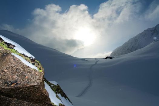 Baikal mountains in winter in snow. Forest in snow-covered mountains.