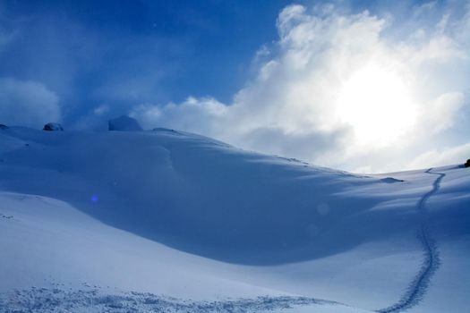 Baikal mountains in winter in snow. Forest in snow-covered mountains.