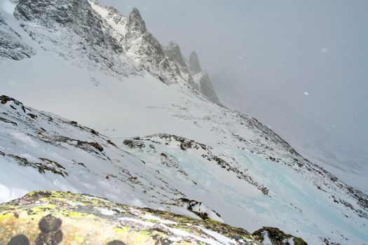 Baikal mountains in winter in snow. Forest in snow-covered mountains.