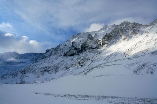 Baikal mountains in winter in snow. Forest in snow-covered mountains.