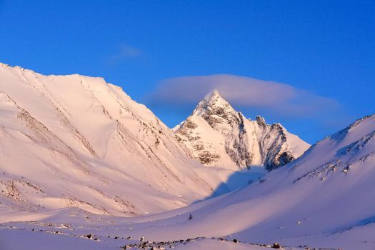 Baikal mountains in winter in snow. Forest in snow-covered mountains.