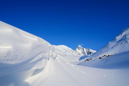 Baikal mountains in winter in snow. Forest in snow-covered mountains.