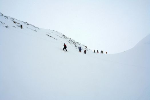 Tankhoy, Russia - January 20, 2019: A company of skiers in the mountains in the snow. Skiing.