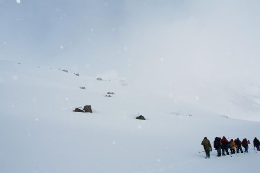 Tankhoy, Russia - January 20, 2019: A company of skiers in the mountains in the snow. Skiing.