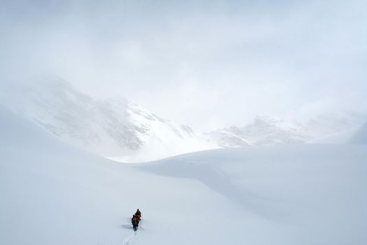 Tankhoy, Russia - January 20, 2019: A company of skiers in the mountains in the snow. Skiing.