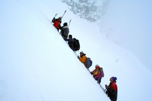 Tankhoy, Russia - January 20, 2019: A company of skiers in the mountains in the snow. Skiing.