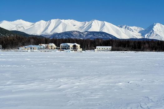 The shore of Lake Baikal in winter. Snow and ice on the baikal.