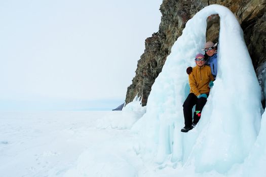 Tankhoy, Russia - January 20, 2019: Skiers are photographed on frozen jets of water. Baikal.