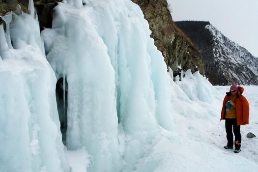 Tankhoy, Russia - January 20, 2019: Skiers are photographed on frozen jets of water. Baikal.