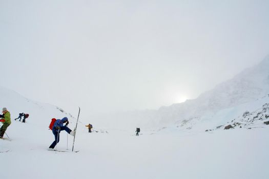 Tankhoy, Russia - January 20, 2019: Skiers ride in the snow in the mountains of Baikal