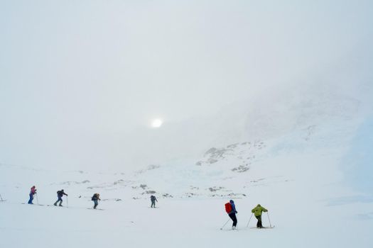 Tankhoy, Russia - January 20, 2019: Skiers ride in the snow in the mountains of Baikal