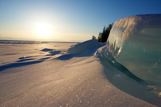 The winter landscape of Lake Baikal. Beautiful mountains in the snow and sky