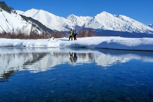 The winter landscape of Lake Baikal. Beautiful mountains in the snow and sky