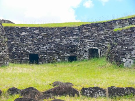 The dwellings of ancient aboriginals on Easter Island. made of shelter stones and walls.