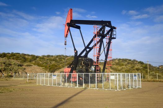 Oil extraction pumpjack in the desert of Mendoza, Argentina.