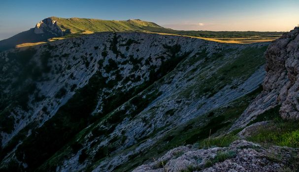 View of the upper plateau of Chatyr-Dag in Crimea in the light of the setting sun.