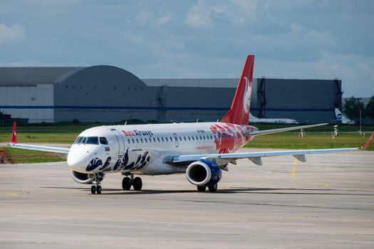 July 2, 2019, Moscow, Russia. Airplane Embraer ERJ-190 Buta Airways at Vnukovo airport in Moscow.