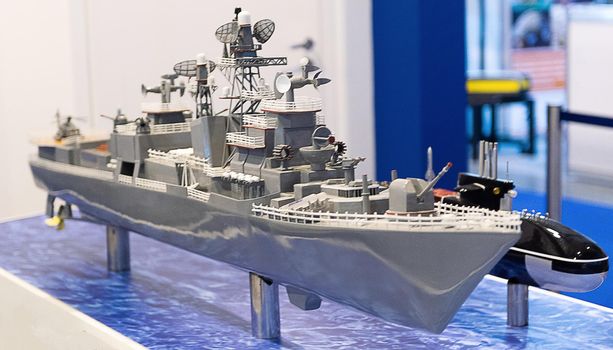 Model of a modern warship in gray at the exhibition.