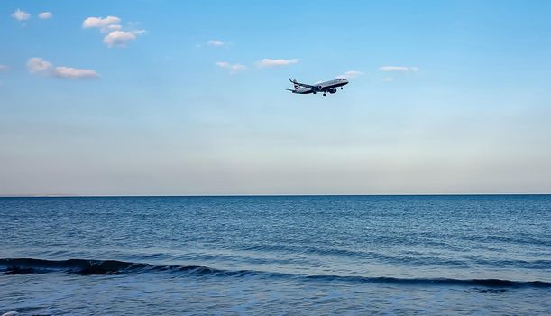 April 11, 2019 Larnaca, Cyprus. Plane of airline 
British Airways comes in to land over the waters of the Mediterranean sea.