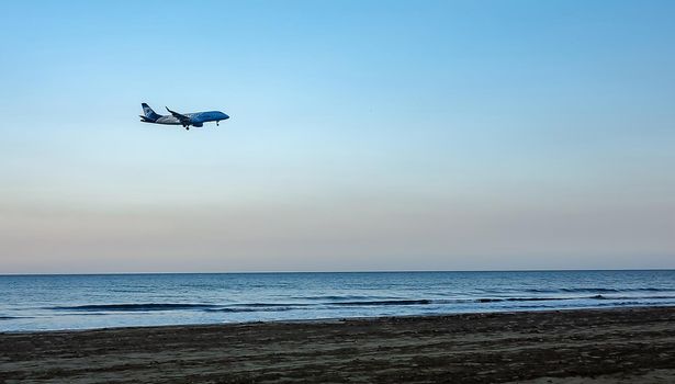 April 11, 2019 Larnaca, Cyprus. Plane of airline 
EgyptAir Express  comes in to land over the waters of the Mediterranean sea.