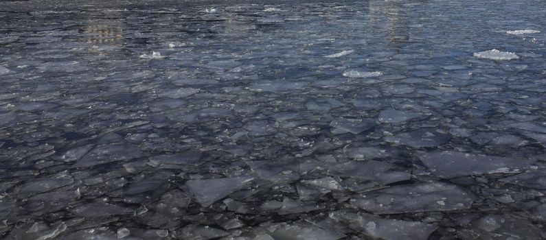 Spring ice drift on the Moscow river on a clear Sunny day