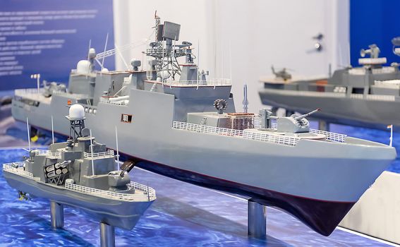 Model of a modern warship in gray at the exhibition.