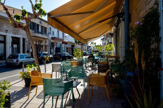April 22, 2019, Limassol, Cyprus. Tables in a summer cafe in the city on a bright Sunny day .